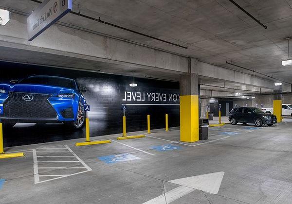 American Airlines Center parking structure in Dallas, 带亮的TX, high quality lighting from parking garage LED light fixtures in the handicap section.